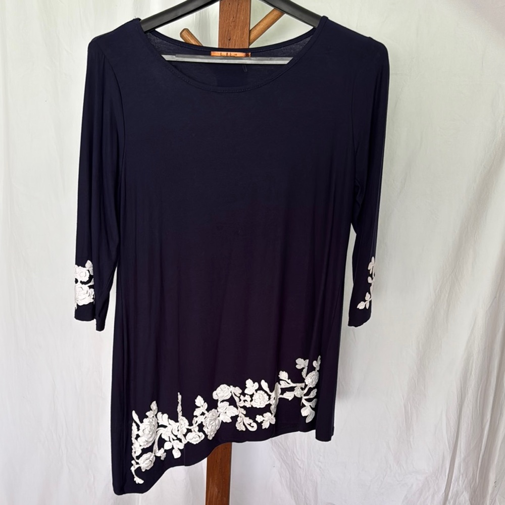 Women's Navy Asymmetrical Top with White Floral Accents